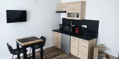 Cuisine ou kitchenette dans l'établissement La Pierre 2 studio entier