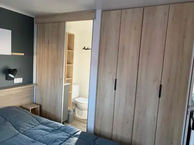Un ou plusieurs lits dans un hébergement de l'établissement Mobil home familial - 3 chambres - 45 m2 - N 211