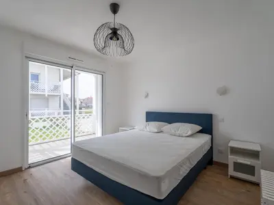 Un ou plusieurs lits dans un hébergement de l'établissement Appartement Neuf 3* à Mimizan - 100m de l'Océan, Piscine, Clim, WiFi, 4 Pers, Ménage inclus - FR-1-50-112
