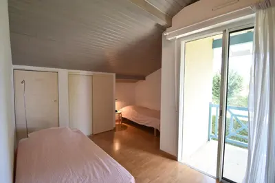 Un ou plusieurs lits dans un hébergement de l'établissement Square Leon Desclaux - Seignosse confortable villa contemporaine avec piscine