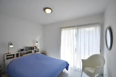 Un ou plusieurs lits dans un hébergement de l'établissement Square Leon Desclaux - Seignosse confortable villa contemporaine avec piscine