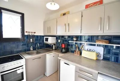 Cuisine ou kitchenette dans l'établissement Voiliers - Seignosse agréable appartement tout proche de la plage et des commerces