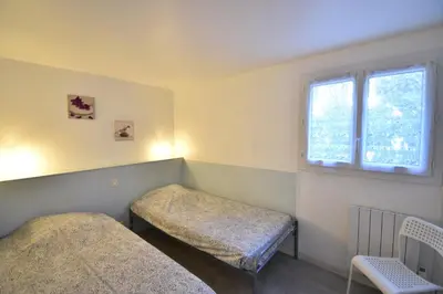 Un ou plusieurs lits dans un hébergement de l'établissement Aire Ona 2 - Hossegor appartement situé à proximité de la plage de la gravière
