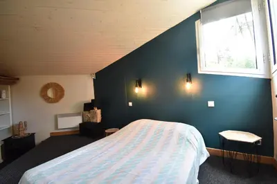 Un ou plusieurs lits dans un hébergement de l'établissement Thais - Hossegor très agréable villa avec piscine située dans un quartier résidentiel