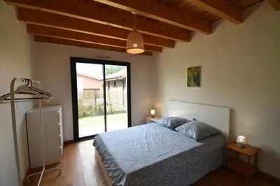 Un ou plusieurs lits dans un hébergement de l'établissement Carolins - Saubion agréable villa en bois dans quartier résidentiel à 400m du bourg de saubion