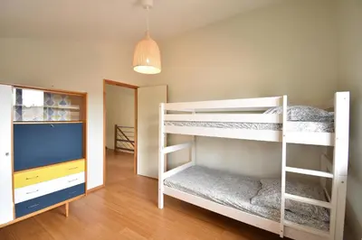 Un ou plusieurs lits dans un hébergement de l'établissement Carolins - Saubion agréable villa en bois dans quartier résidentiel à 400m du bourg de saubion