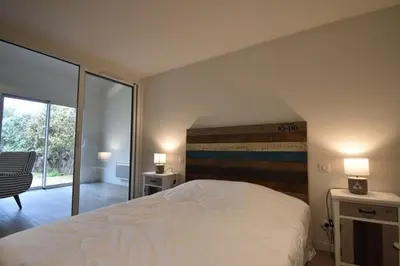 Un ou plusieurs lits dans un hébergement de l'établissement Maisonnette - Hossegor agréable maisonnette entre lac et océan