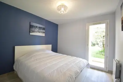 Un ou plusieurs lits dans un hébergement de l'établissement Ermitage - Hossegor centre ville confortable appartement en rez de jardin