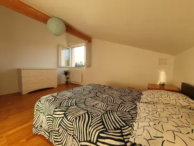 Un ou plusieurs lits dans un hébergement de l'établissement Maison à Tosse proche des plages