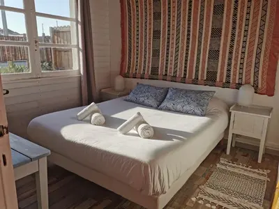 Un ou plusieurs lits dans un hébergement de l'établissement Guesthouse Évasion