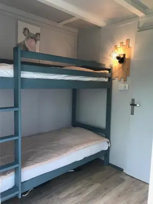 Un ou plusieurs lits dans un hébergement de l'établissement Village Vacances aux Villages sous les Pins