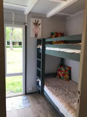 Un ou plusieurs lits dans un hébergement de l'établissement Village Vacances aux Villages sous les Pins