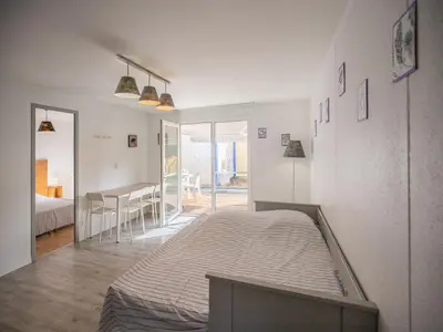 Un ou plusieurs lits dans un hébergement de l'établissement Résidence Vacancéole Sun Hols Les Villas du Lac