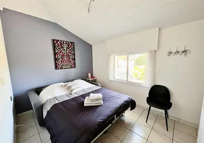 Un ou plusieurs lits dans un hébergement de l'établissement La Villa Capucine