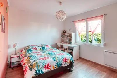 Un ou plusieurs lits dans un hébergement de l'établissement Villa la p'tite guinguette