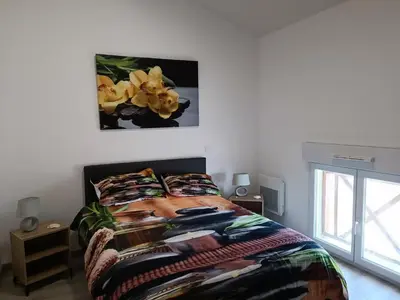 Un ou plusieurs lits dans un hébergement de l'établissement Mimizan Apt neuf 80m2 +terrasse 100m plage