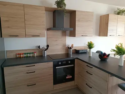 Cuisine ou kitchenette dans l'établissement Mimizan Apt neuf 80m2 +terrasse 100m plage