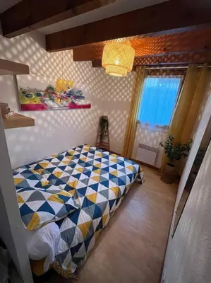 Un ou plusieurs lits dans un hébergement de l'établissement Maison 400m plage