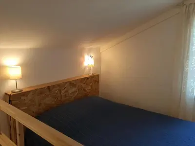 Un ou plusieurs lits dans un hébergement de l'établissement Maison confortable pour 4 à Soorts-Hossegor avec terrasse et parking - FR-1-239-929