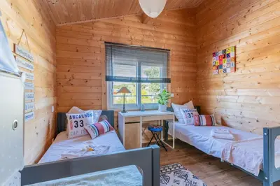 Un ou plusieurs lits dans un hébergement de l'établissement Villa Perle du Bassin Vue Mer - Arcachon-La Hume