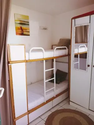 Un ou plusieurs lits dans un hébergement de l'établissement Appartement Golf et Océan