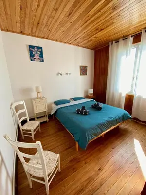 Un ou plusieurs lits dans un hébergement de l'établissement Chaleureuse villa sur la dune